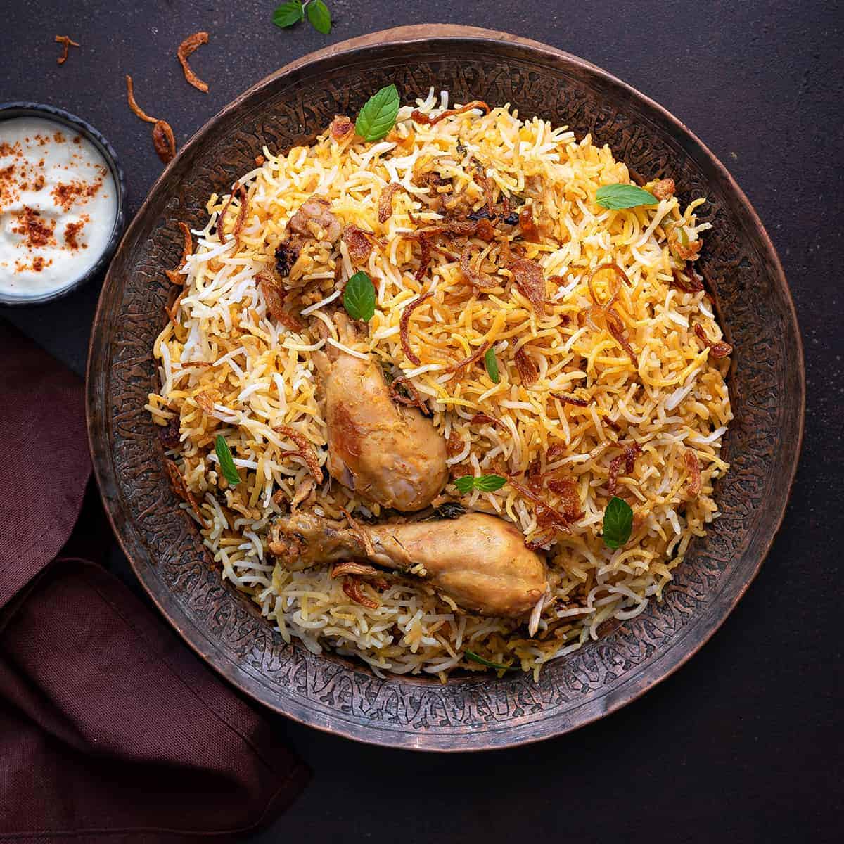 Chicken Briyani served on a plate with saffron basmati rice